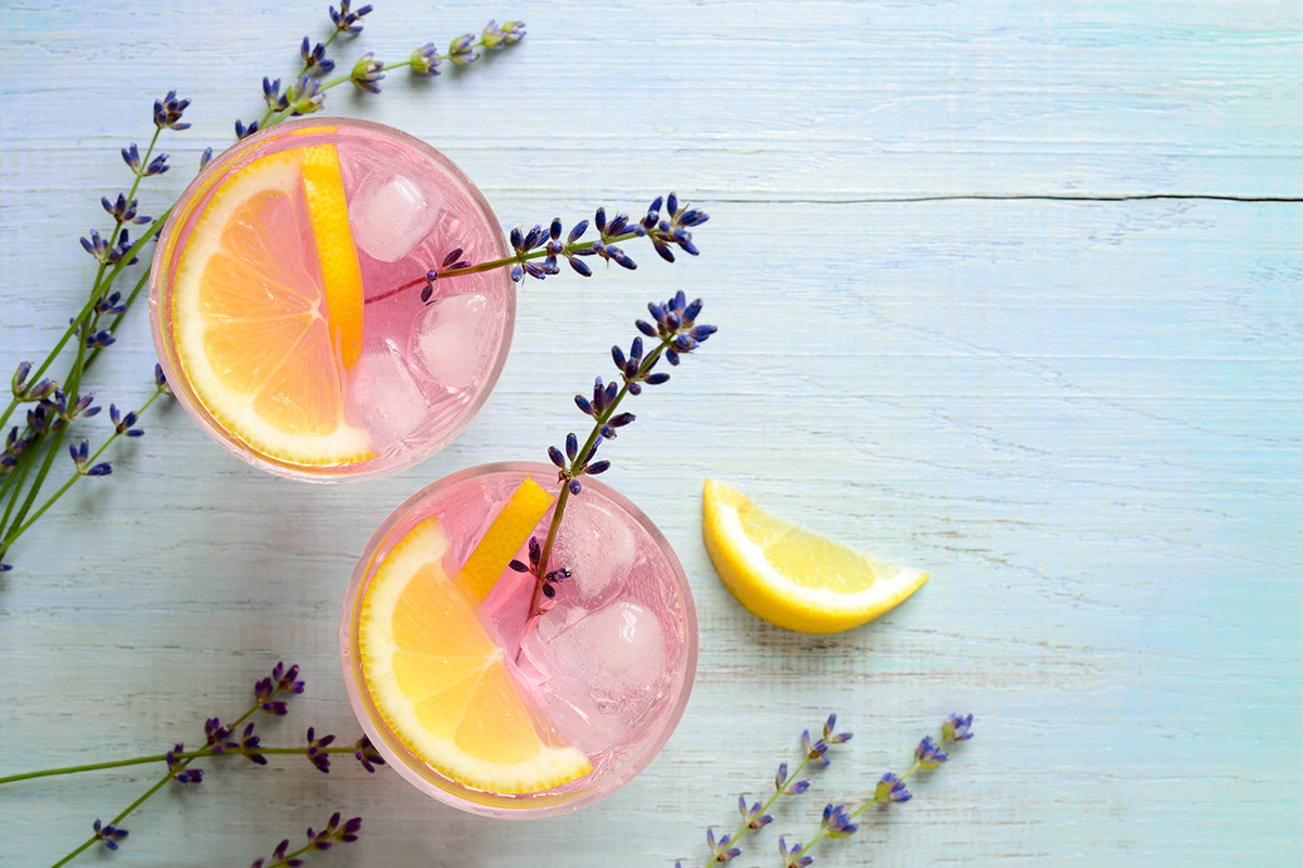 https://149533724.v2.pressablecdn.com/wp-content/uploads/2021/06/homemade-summer-cocktail-with-lavender-and-lemon.jpg